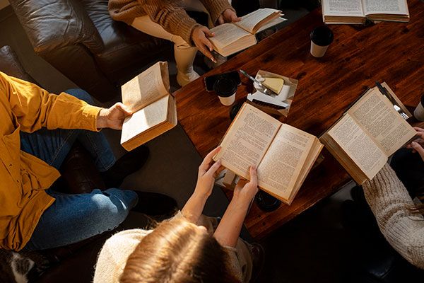 youth group reading the bible in a group