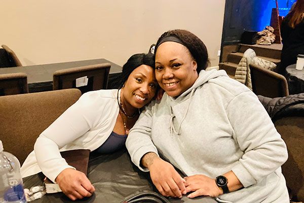 two friends take a picture together in a church in sherwood arkansas